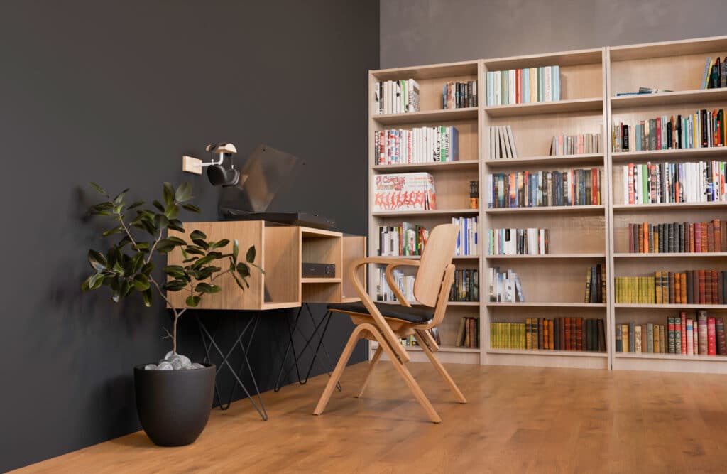 Aménagement sur mesure d'une médiathèque professionnelle avec bureau suspendu en bois clair, étagères assorties et finition haut de gamme signée Kopo Création